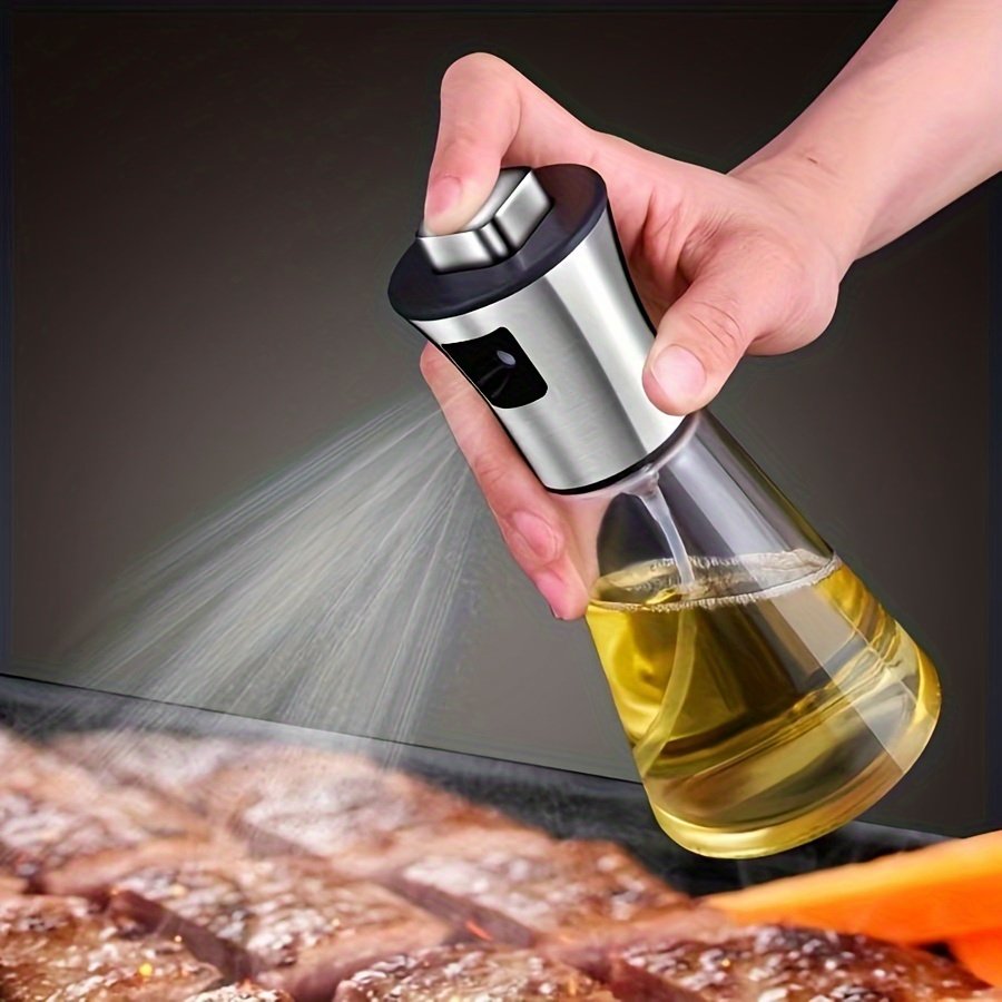 1721803110693-5b8a99ad80a944f9a698f3da00aaf0d8-goods.jpeg 304 Stainless Steel & Glass Oil Spray Bottle - Large Capacity Pressurized Spray for Kitchen, BBQ, Grilling - BPA-Free, Triangular Design, Perfect for Olive & Barbecue Oils - Eid Al-Adha Mubarak Gift Idea, Kitchen Accessory | Sleek Accessory | Bpafree Material, Oil Sprayer Bottle for Cooking - Image 1