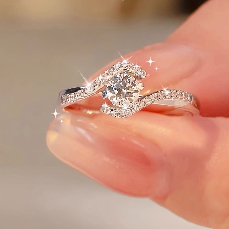 1ba2fa2c6c9a87568111d0568769ed9f_zX0r9WLKjjQKd.jpg Elegant 925 Sterling Silvery Ring, Suitable for Daily And Gift Occasions, Valentine's Day Jewelry, Hollowed Out Twisted Four Claw Circular Engagement Ring - Image 1